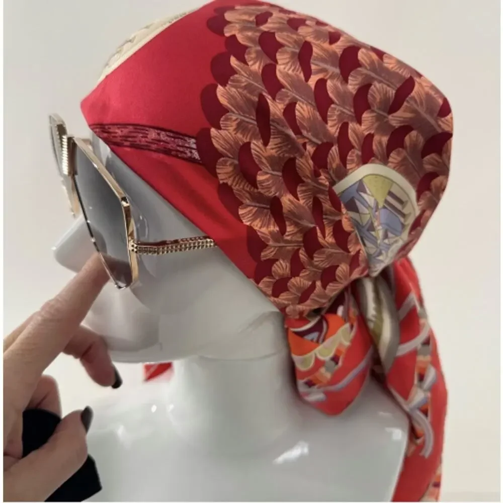 Hermes, silk scarf. The theme is the magic umbrella, coral colorway w/vignettes.